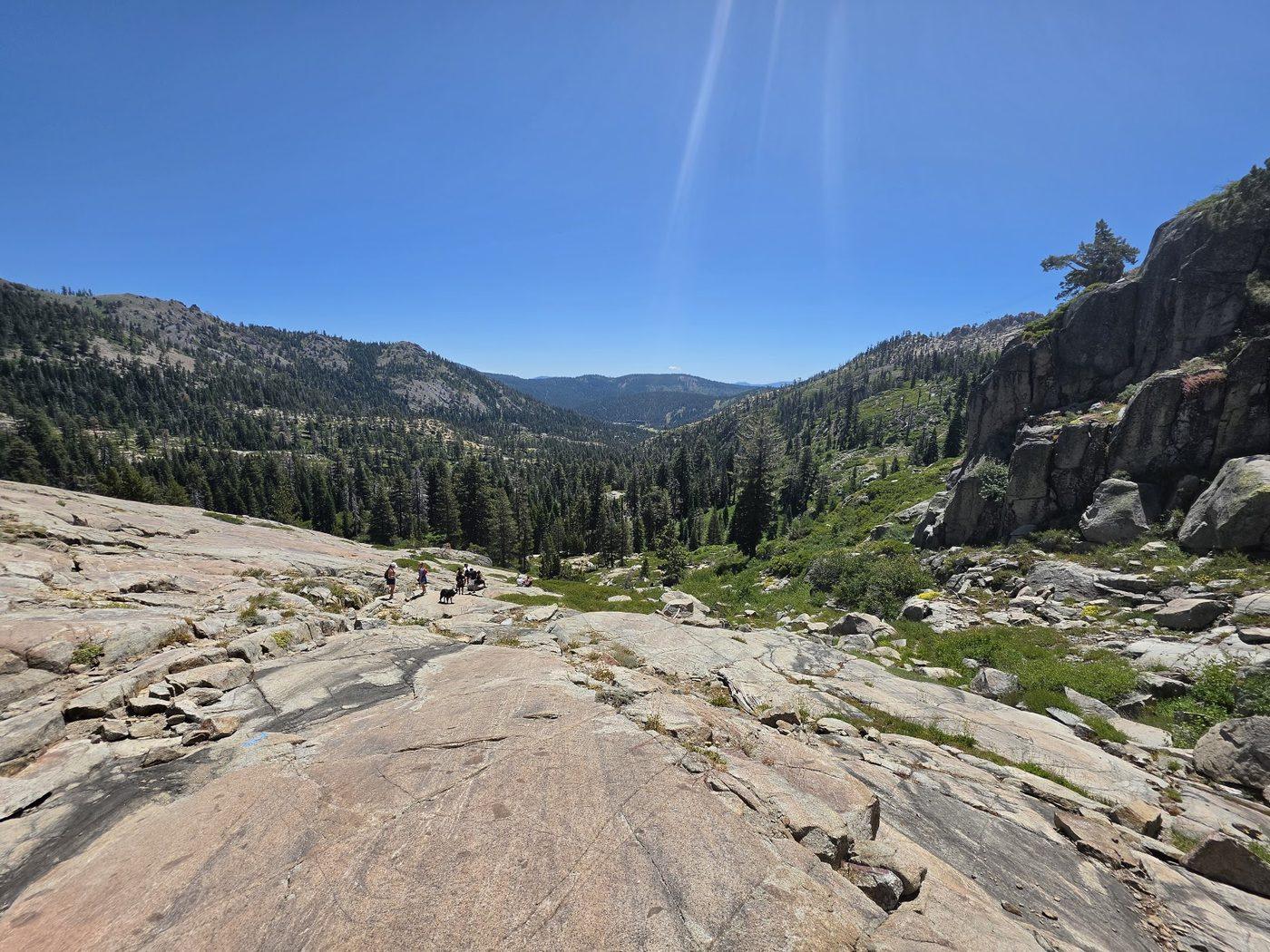 Granite slabs on the Shirley Canyon trail looking down Olympic Valley in summer